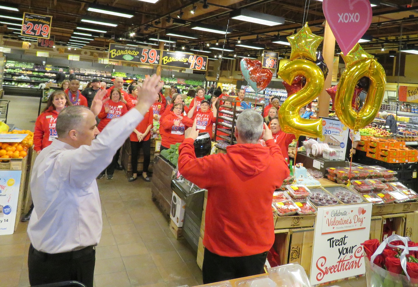 Wegmans employees celebrate the Military Road location's 20th anniversary Thursday morning. (Photos by David Yarger)